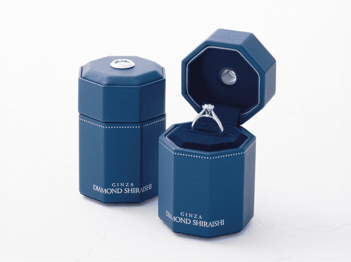 Open jewelry box showcasing a diamond ring